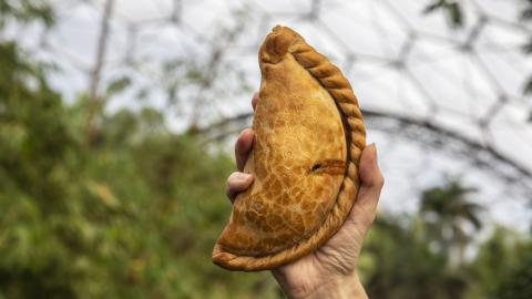 Hand holding Cornish pasty at Eden Project